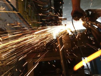 Low angle view of man working at factory