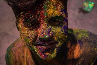 Close-up portrait of man with powder paint on face