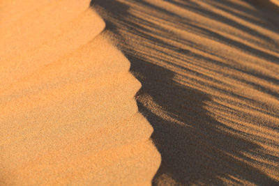 High angle view of shadow on sand