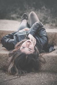 Portrait of a young woman lying down