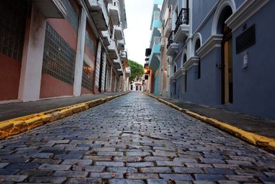 Alley amidst buildings in city