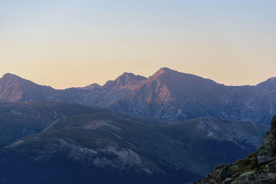 Scenic view of mountains against sky during sunset