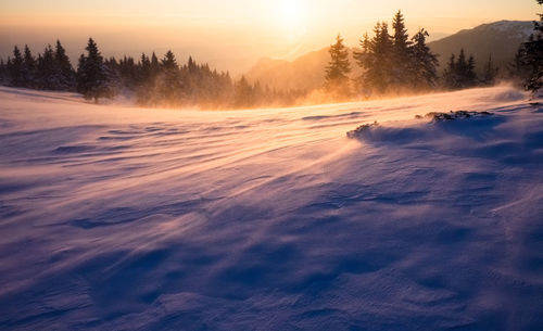 Scenic view of landscape against sky during sunset