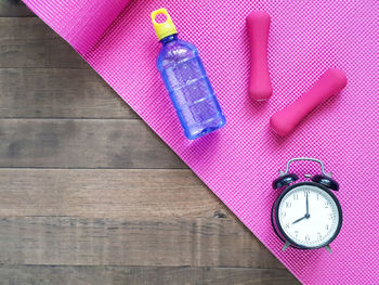 Directly above shot of clock on table
