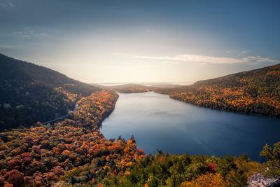 Scenic view of lake against sky during autumn