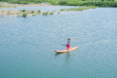 Man kayaking in sea