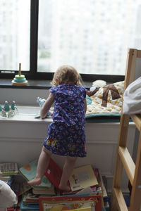 Girl climbing in nursery