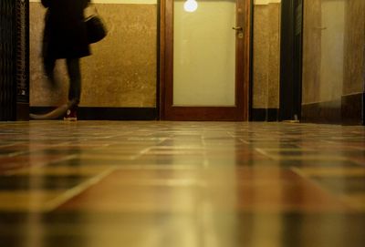 Low section of woman standing on floor