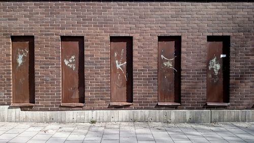 Brick wall with closed doors