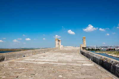 Footpath leading towards blue sky