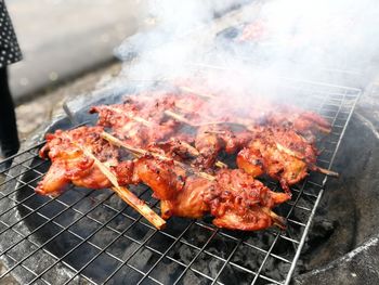 Close-up of meat on barbecue grill