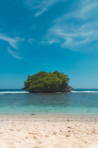 Scenic view of sea against blue sky