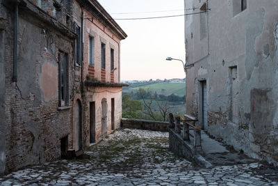 Footpath amidst buildings in town