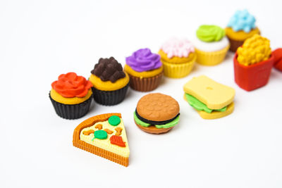 Close-up of multi colored candies against white background