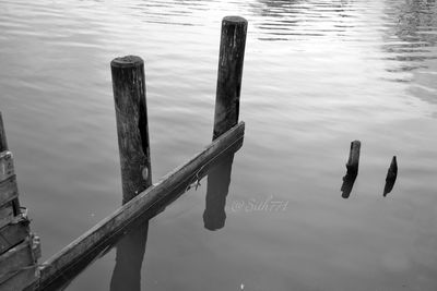 Close-up of wooden post in lake