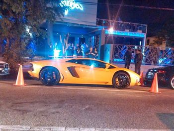 Cars on illuminated car at night