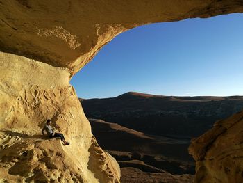 Man sitting on rock