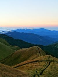 Scenic view of mountains against sky during sunset