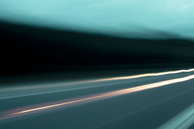 Close-up of light trails against sky at night