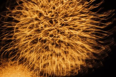 Abstract image of fire crackers against black background