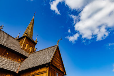 Low angle view of temple building against blue sky