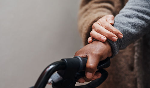 Cropped hand of man holding metal