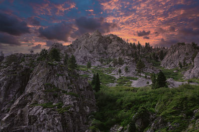 Scenic view of rocky mountains against sky during sunset