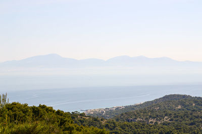 Scenic view of sea with mountains in background