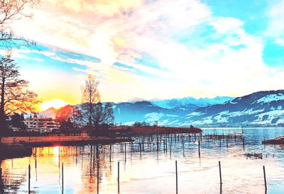 Scenic view of lake against sky during sunset