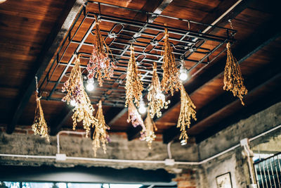 Low angle view of chandelier hanging from ceiling