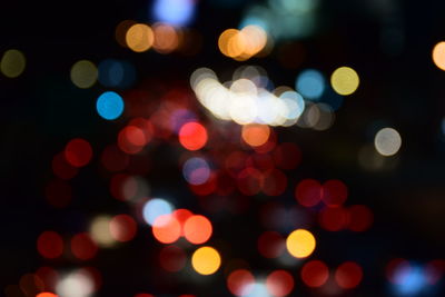 Defocused image of illuminated lights at night