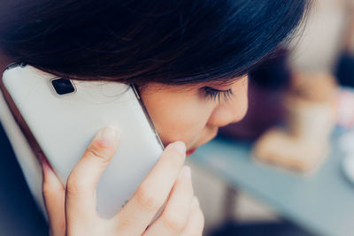 Close-up of woman talking on smart phone