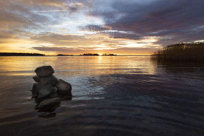 Scenic view of sea against sky during sunset