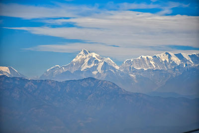 Scenic view of snowcapped mountains against sky