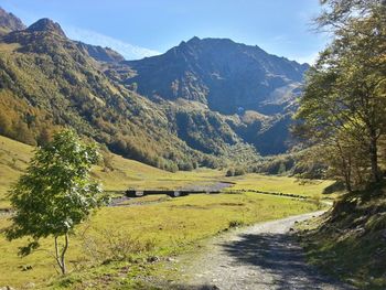 Scenic view of landscape and mountains against sky