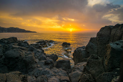 Scenic view of sea against sky during sunset