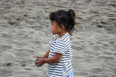 Full length of girl standing on beach