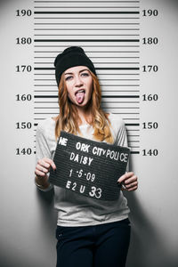 Woman getting mug shot taken