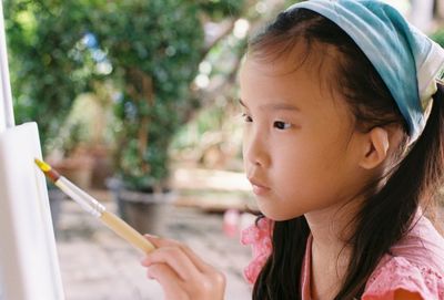 Close-up portrait of a girl looking at camera