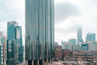 View of a cloudy day in a modern city, downtown abu dhabi landmarks, world trade center towers