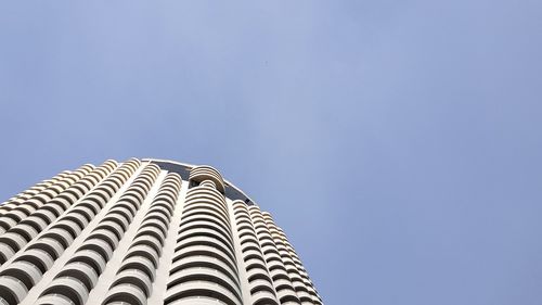 Low angle view of skyscraper against clear sky