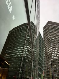 Low angle view of modern buildings against sky