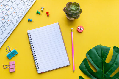 High angle view of pen and book on table