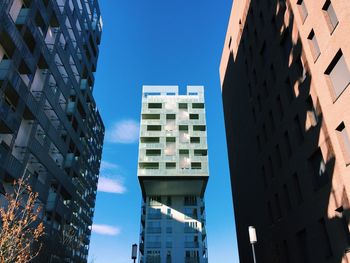 Low angle view of buildings against clear blue sky