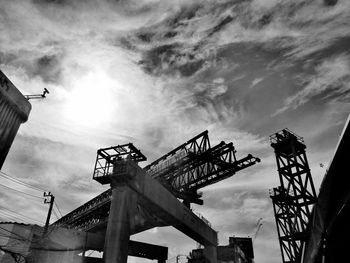 Low angle view of construction site against sky