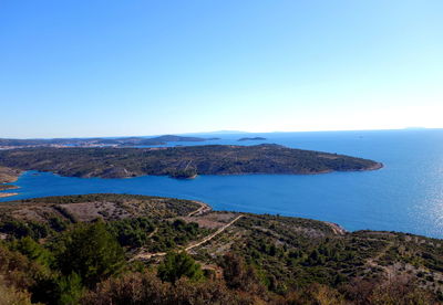 Scenic view of sea against clear blue sky