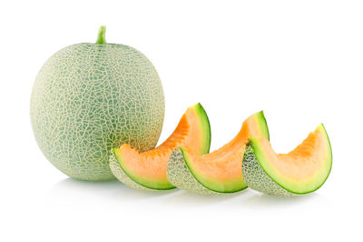 Close-up of melon against white background
