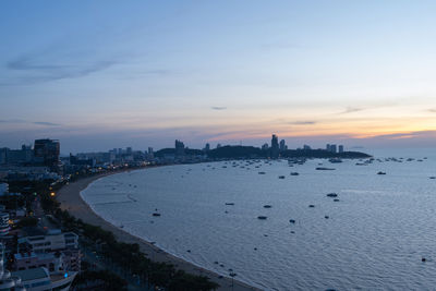 High angle view of buildings against cloudy sky