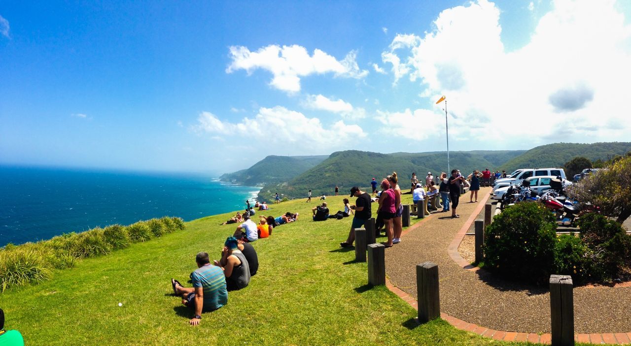 large group of people, sea, sky, person, men, leisure activity, lifestyles, water, mountain, horizon over water, vacations, scenics, beach, mixed age range, tourist, grass, nature, blue, tranquil scene