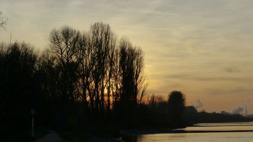 Scenic view of landscape against sky at sunset